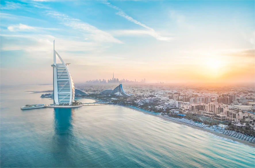Scenic view of Jumeirah Beach with Burj Al Arab during sunset in Dubai