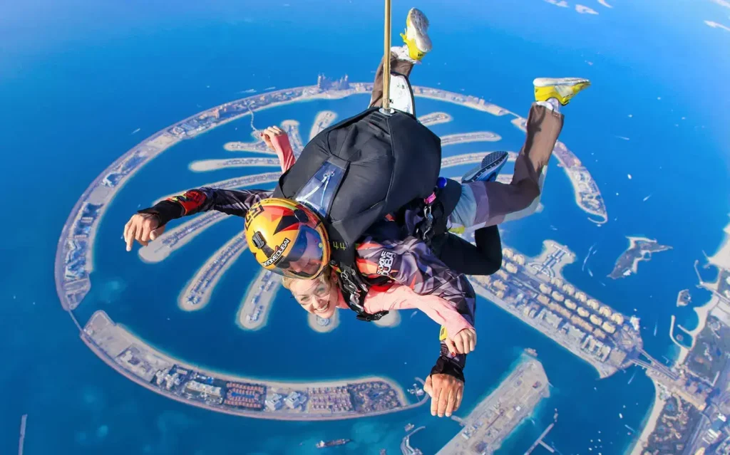 Skydiver free-falling above Palm Jumeirah Dubai, a top adventure activity.