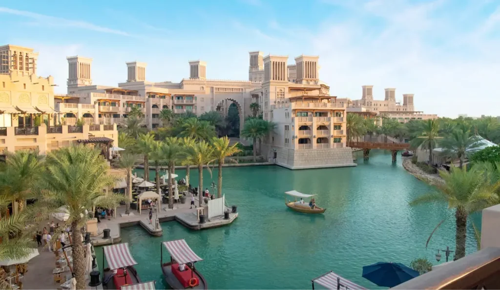 Canal-side shopping and dining at Souq Madinat Jumeirah with traditional Arabian architecture